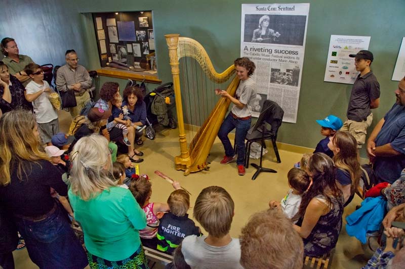 Harpist Nuiko Wadden gives a demo during the Free Family Concert's Tour of the Orchestra. Photo by rr jones.
