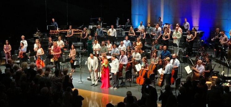 Musicians bowing in front of audience