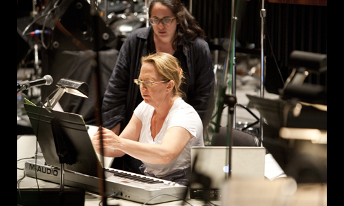 Composers Nora Kroll-Rosenbaum (standing) and Laura Karpman collaborate during a rehearsal for Hidden World of Girls: Stories for Orchestra. Photo: rr jones