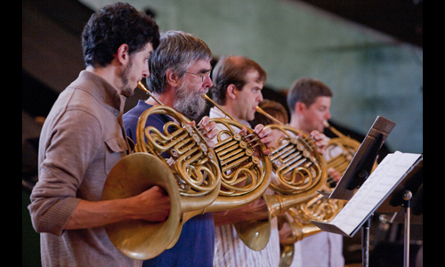 Festival horn section warms up for an afternoon rehearsal. Photo: rr jones