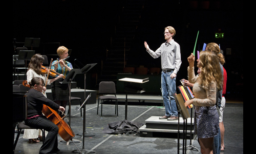 Student Staff Co-Director Luffy Bailey conducts the Student Staff Ensemble. Photo: rr jones