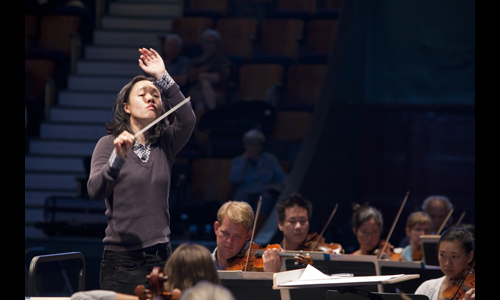 Conductor Carolyn Kuan leads the Festival Orchestra. Photo: rr jones