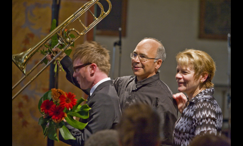 Composer John Mackey, trombonist Joseph Alessi, and Marin Alsop triumphantly close the 2012 Cabrillo Festival at Mission San Juan Bautista. Photo: rr jones