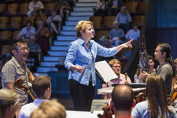 Composer Huang Ruo and sheng master Wu Wei in rehearsal with conductor Marin Alsop. Photo by rr jones.