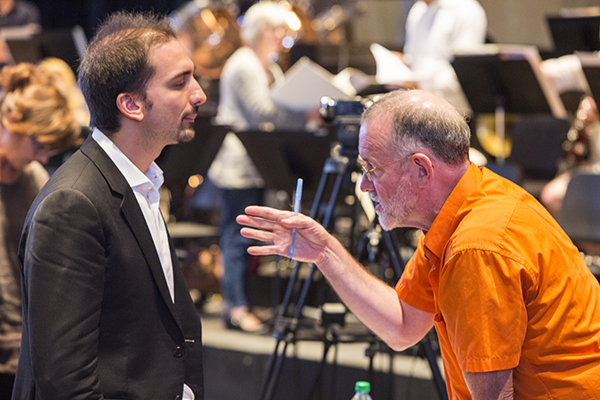Conducting faculty James Ross refines a point with participant Stefano Sarzani. Photo by rr jones.