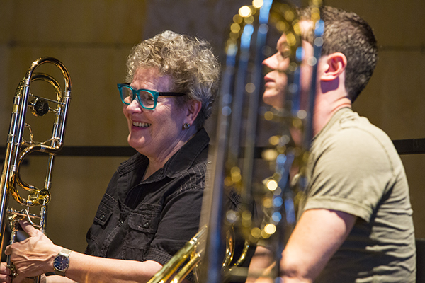 Principal trombone Ava Ordman enjoys a chuckle during rehearsal. Photo by rr jones.