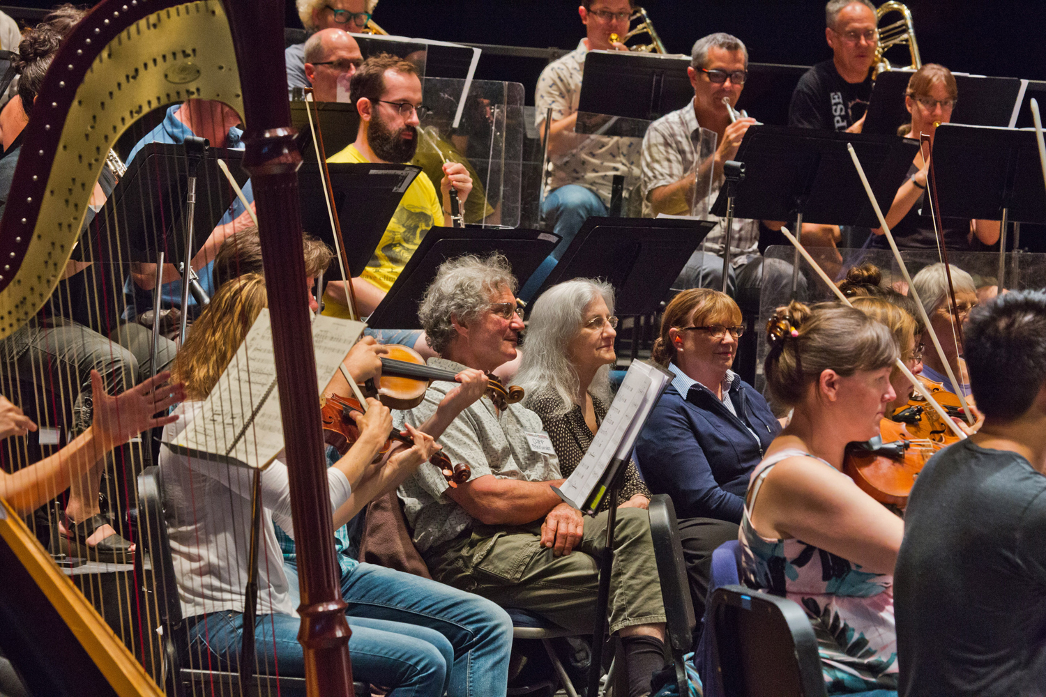 Donors sit "Inside the Orchestra" during a rehearsal.