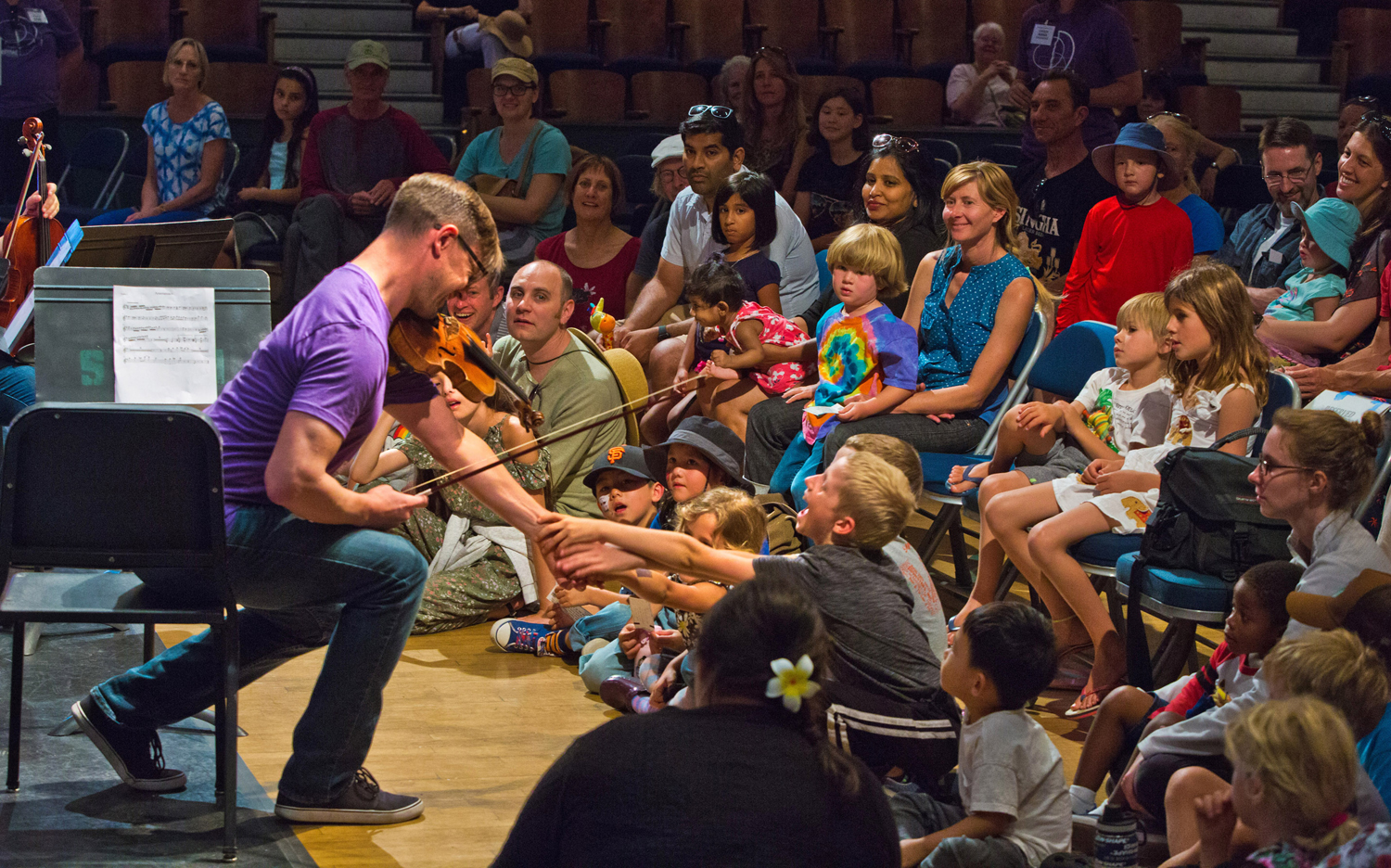Violinist Ben Tomkins makes a connection with young Free Family Concert audience member!