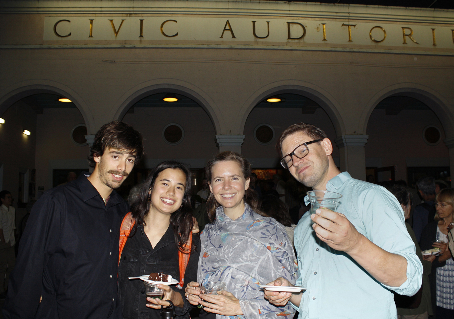 Orchestra members and friends enjoy the post-concert reception outside the Santa Cruz Civic. (staff photo)