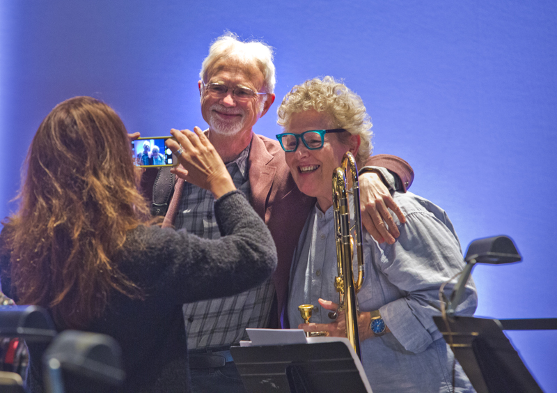 John Adams mugs it up with orchestra musicians. Photo by rr jones.