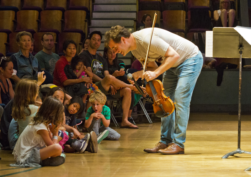 Violinist Rob Simonds interacts with young fans during the Free Family. Photo by rr jones.