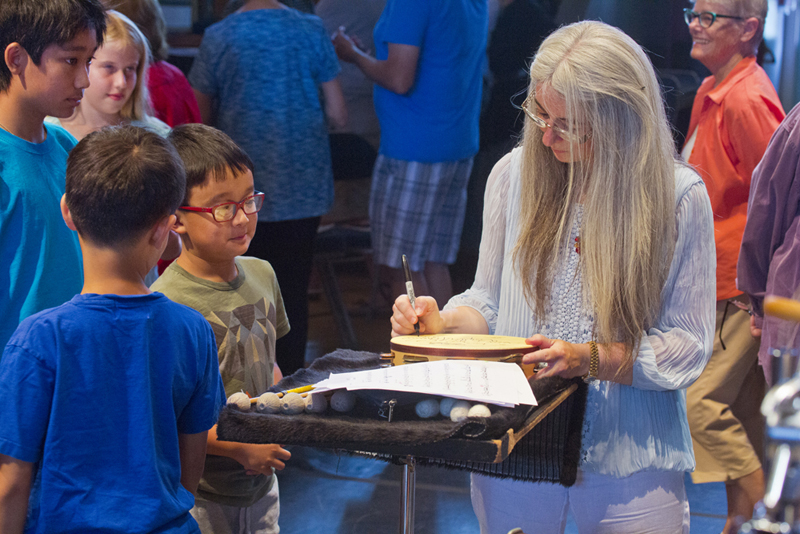 Dame Evelyn Glennie signs autographs for young fans after a rehearsal. photo by rr jones