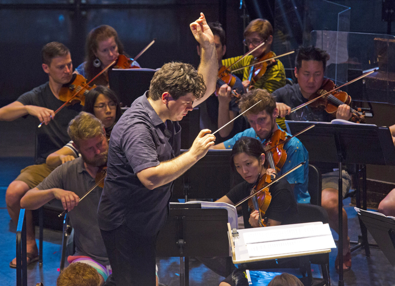 Cristian Macelaru in rehearsal with his Cabrillo Festival Orchestra. photo by rr jones