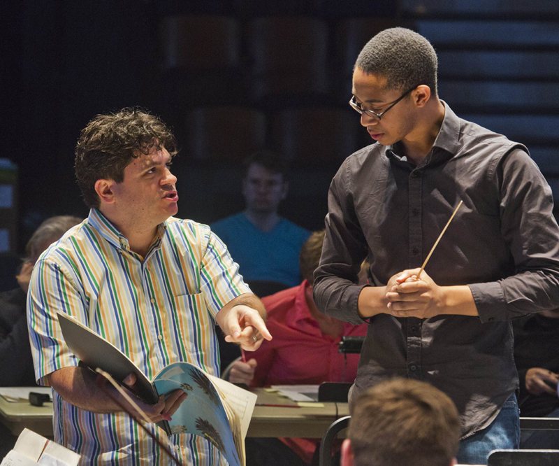 Cristi works with conducting fellow William Walker during the Conducting Workshop. photo by rr jones