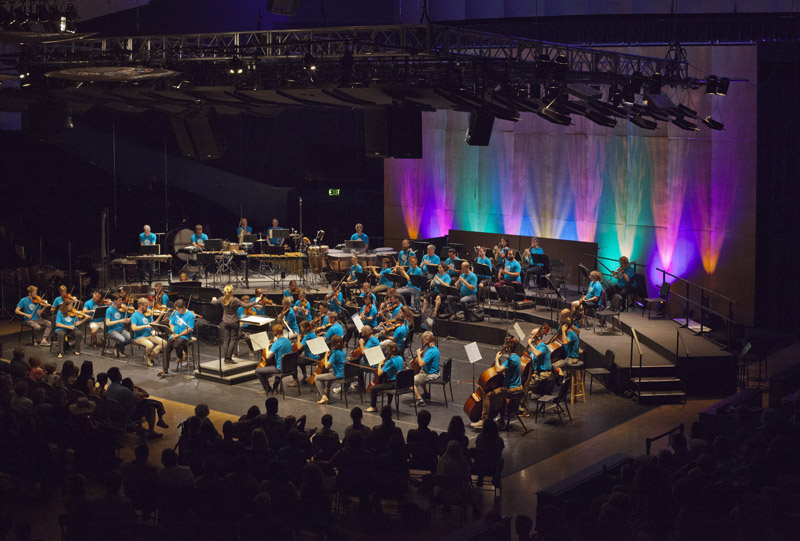 Guest conductor Gemma New leads the Festival Orchestra as Cristi narrates the Free Family Concert. photo by rr jones