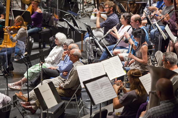 Festival donors invited to sit inside the orchestra during a rehearsal. Photo by rr jones.