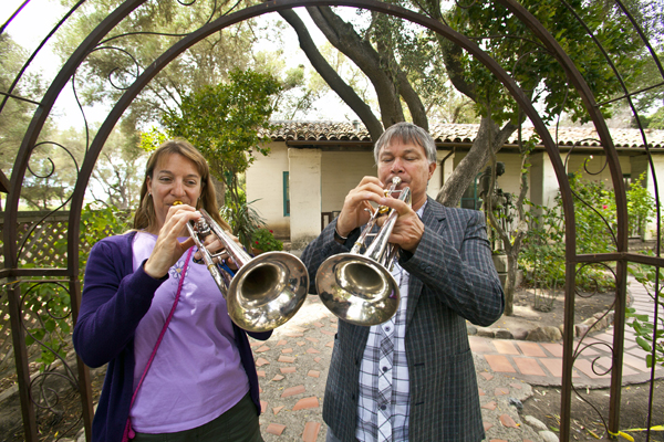 Married Festival trumpeters Lauren Eberhart and Andrew Gignac warm up at Mission San Juan Bautista. Photo by rr jones.