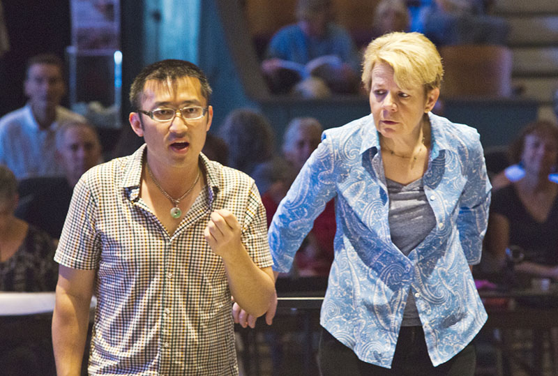 Composer Huang Ruo in rehearsal with conductor Marin Alsop and the Cabrillo Festival Orchestra