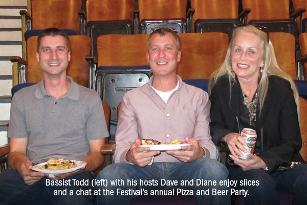 Bassist Todd (left) with his hosts Dave and Diane enjoy slices and a chat at the Festival's annual Pizza and Beer Party.
