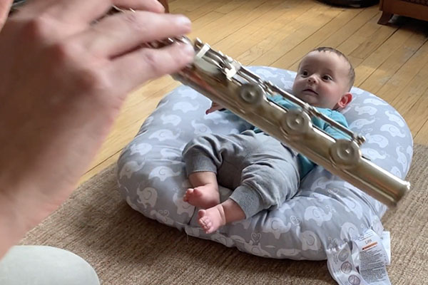 Baby listening to flute